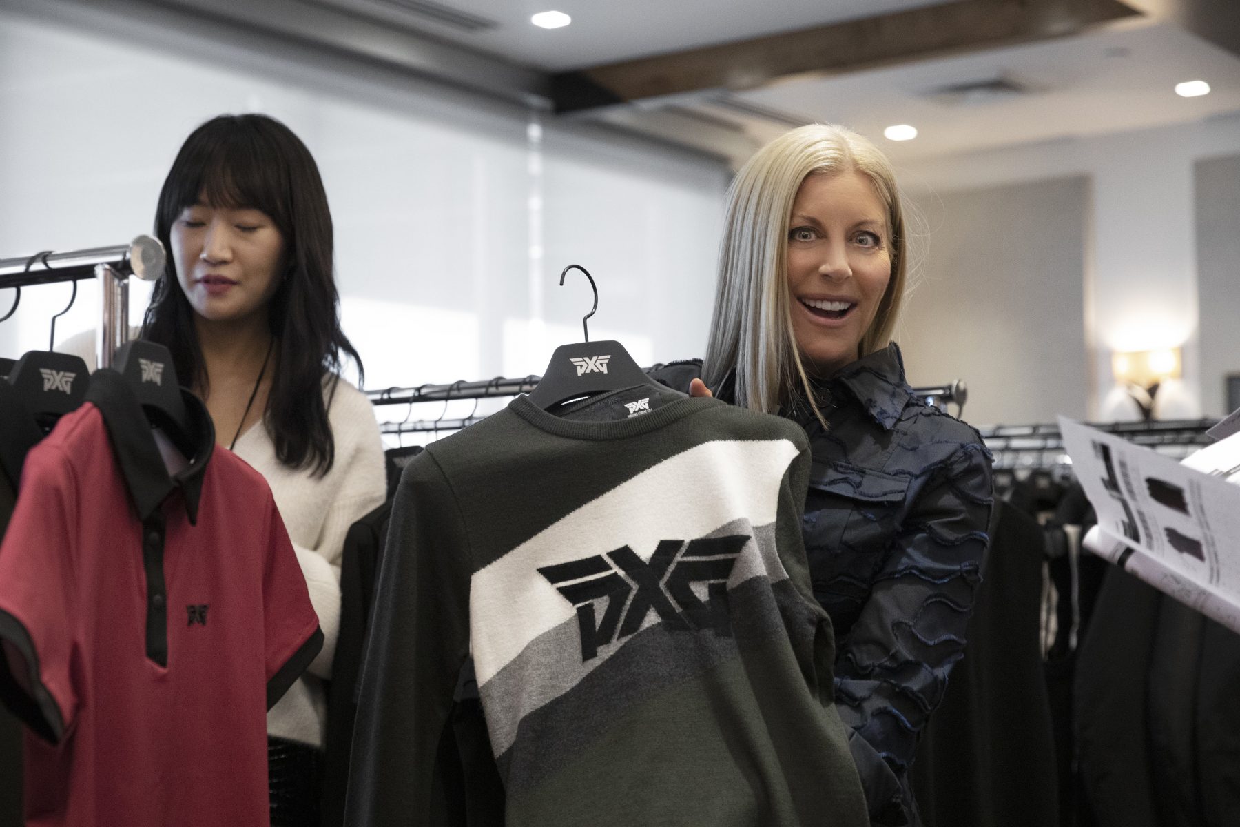 Renee Parsons holding PXG apparel