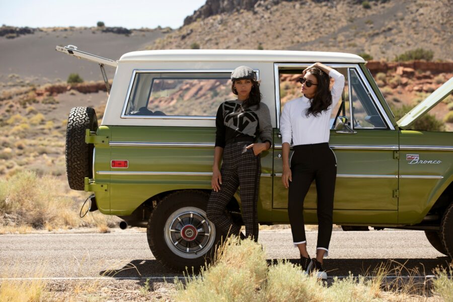 PXG Apparel models standing in front of a Ford Bronco