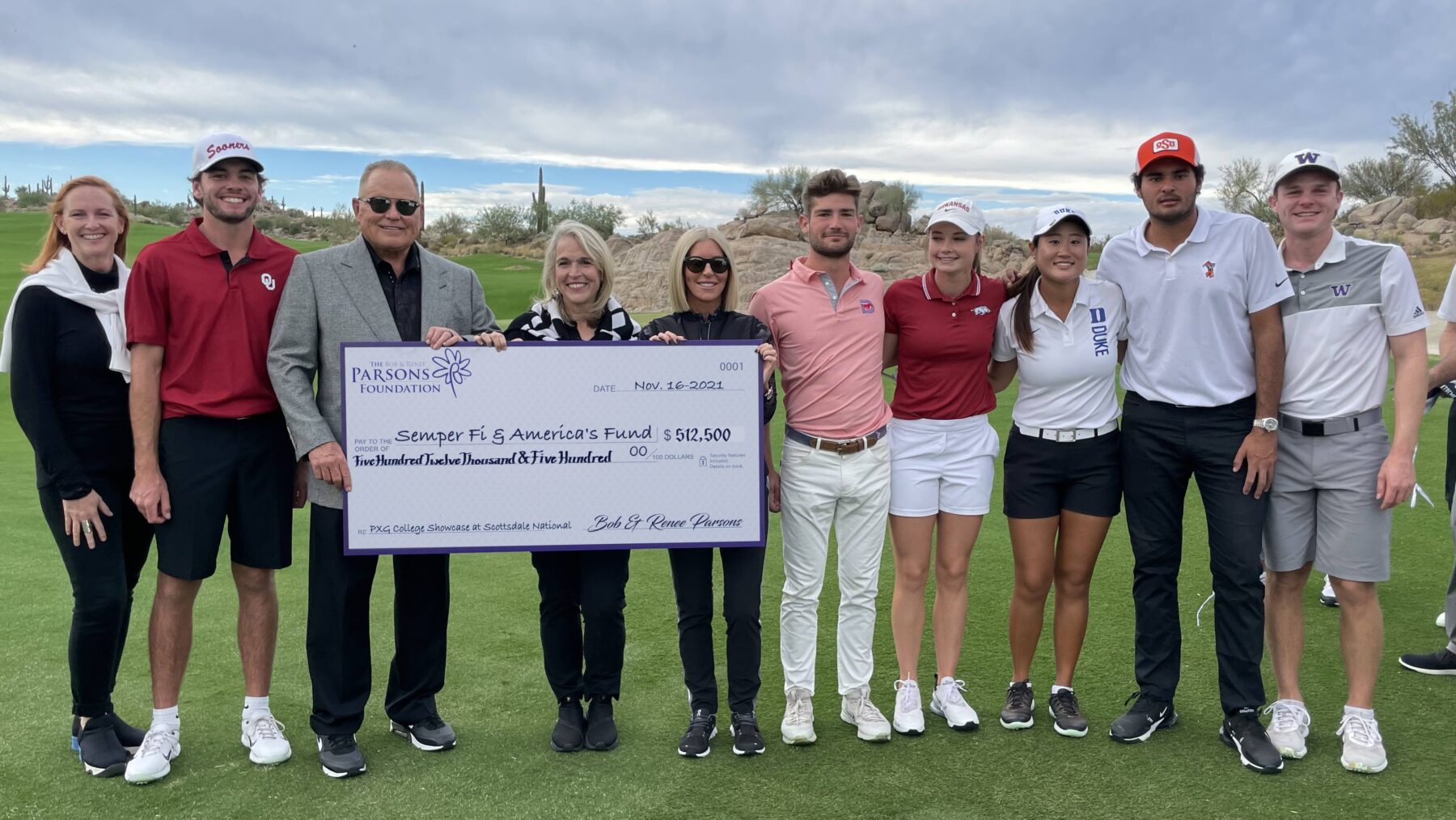 Group holding large check at PXG College Showcase 2021